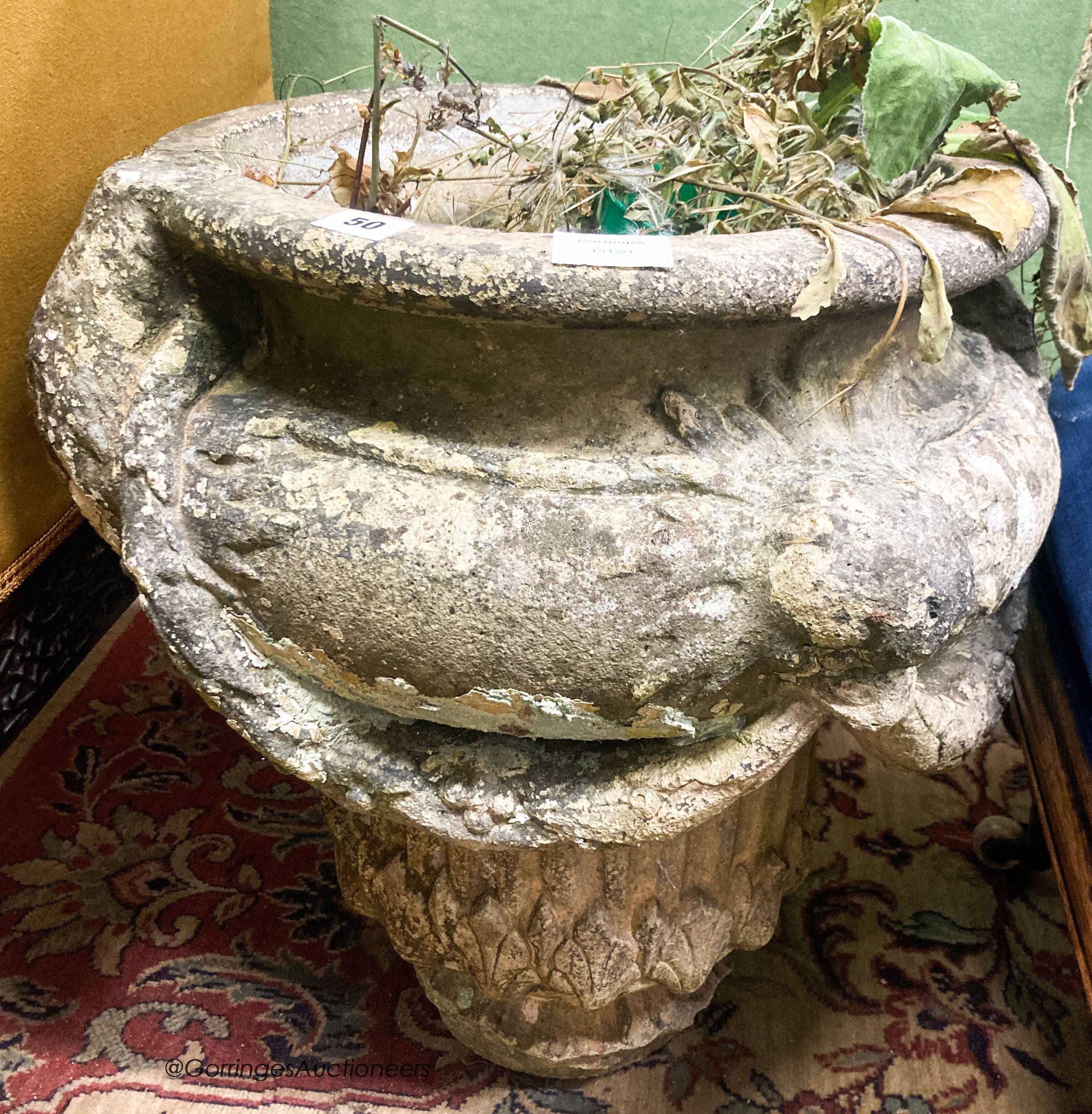 A reconstituted stone garden planter, diameter 50cm H.54cm